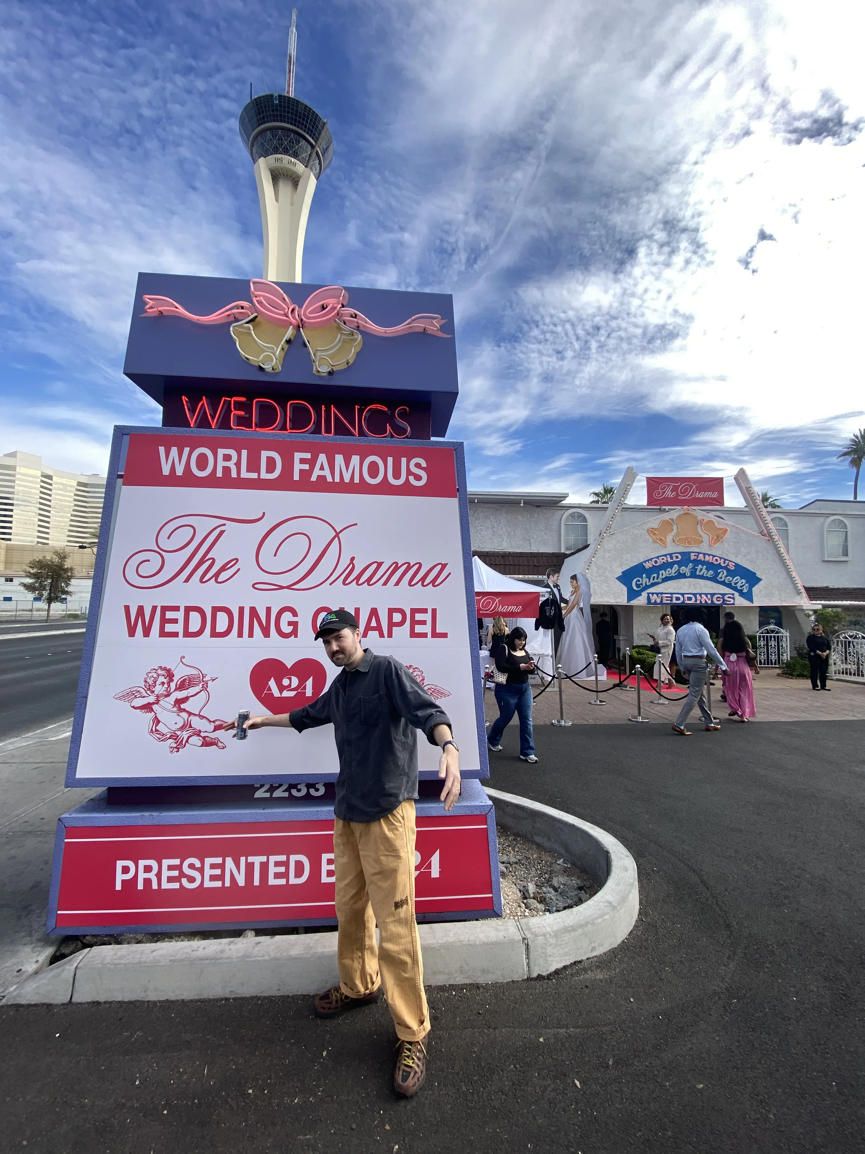 Slowburn contributor standing in front of the sign for the wedding chapel pop up event.